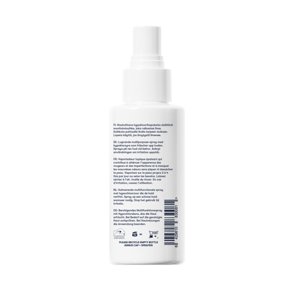 A white spray bottle of Topical Skin Spray is shown from the back on a white background, featuring a multilingual label with instructions and ingredients. This soothing spray calms irritation and reduces blemishes for clear, comfortable skin.